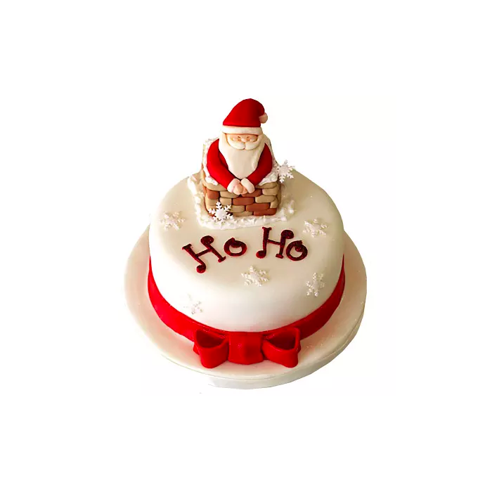 Premium Photo | Christmas cake prepared with sugar paste with santa claus  christmas tree and gift figures on it